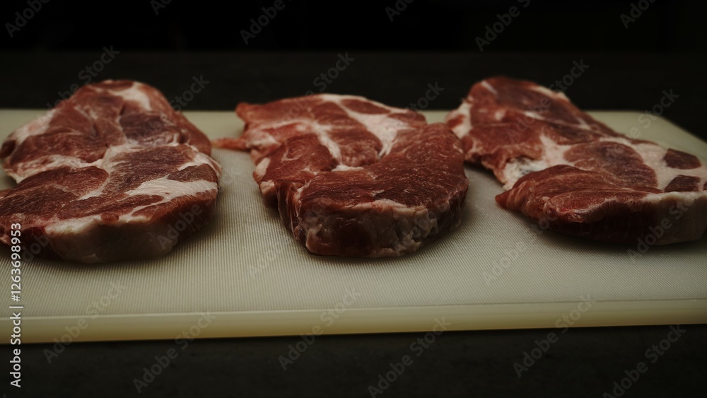 Fototapeta premium Preparing the pan and steak: seasoning, heating, and cooking to perfection. Juicy steak with a golden crust—perfect for culinary projects!