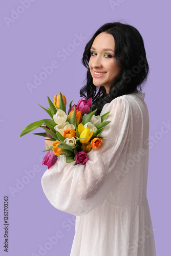 Happy young woman with bouq...