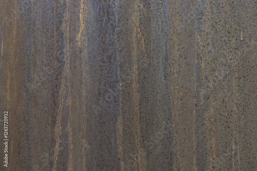 Surface of rusted metal door with weathered shades and texture
