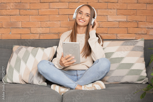 Young woman in headphones w...
