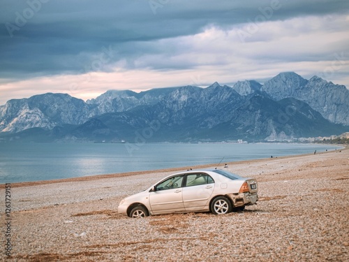Abandoned car stuck on Antalya beach