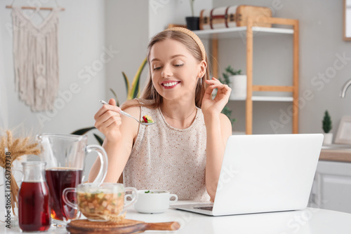 Young woman with tasty okro...