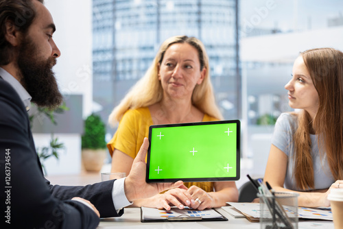Wallpaper Mural Broker holding green screen tablet, meeting with clients to provide stock exchange analysis. Financial advisor with chroma key device looking at market shares, helping family maximize income Torontodigital.ca