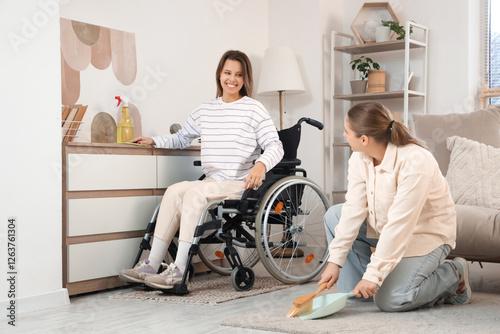 Young woman in wheelchair a...