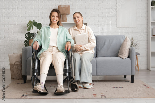 Young woman in wheelchair a...