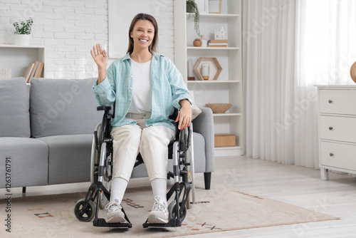 Young woman in wheelchair w...