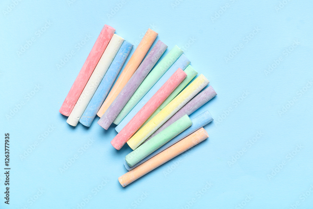 Obraz premium Colorful chalks on blue background