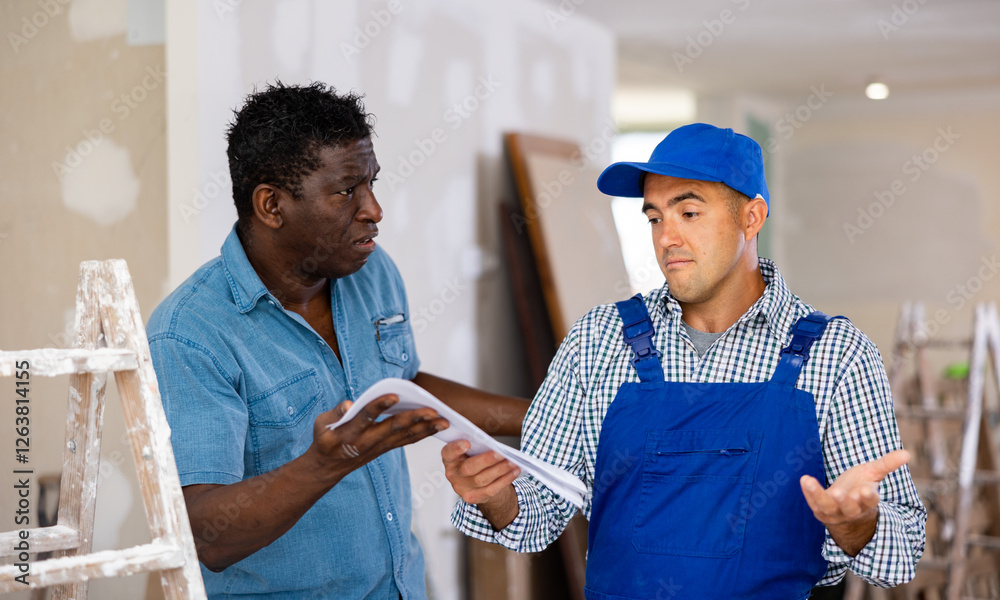 Fototapeta premium Owner of apartment expresses dissatisfaction with the work performed by the foreman