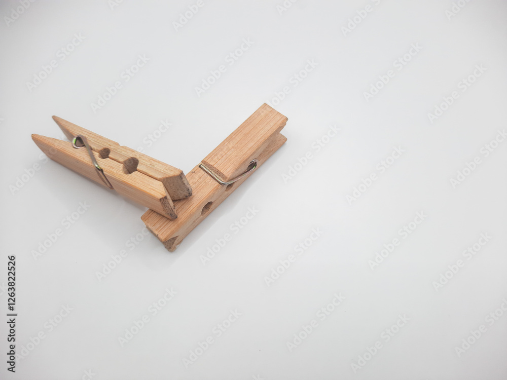 Clothesline clip made of wood with white background Clothesline clip made of wood with white background