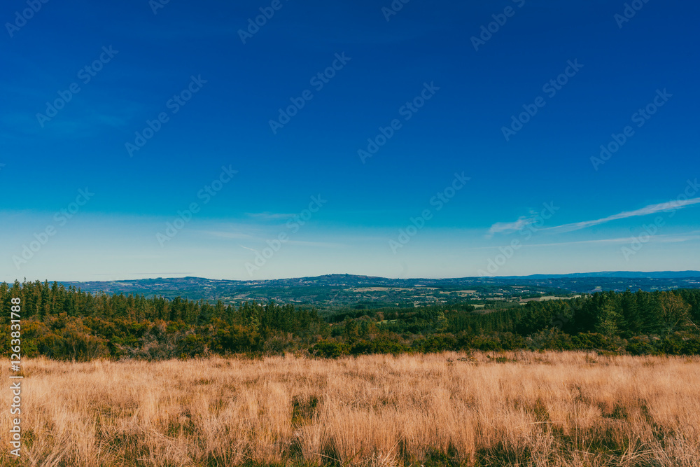 Landscape with view of crops and beautiful mountains with blue sky on the French Way. Stage Portomarin - Palas de Rei. Spain. Landscape with view of crops and beautiful mountains with blue sky on the French Way. Stage Portomarin - Palas de Rei. Spain.