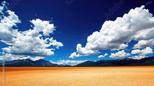 Expansive desert landscape under a vibrant sky with dramatic clouds and distant mountains