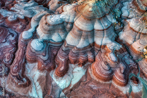 Aerial view of the Bentonite Hills after sunset showing the multi-colored layers of clay and sediment near the Mars Desert Research Station near Hanksville, Utah. photo