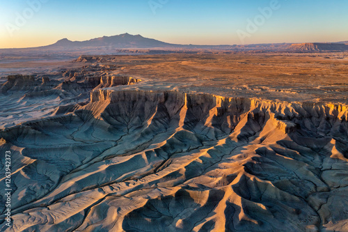 Aerial photo of Moonscape Overlook just after sunrise with the Henry Mountains in the distance near Factory Butte and Hanksville, Utah. photo