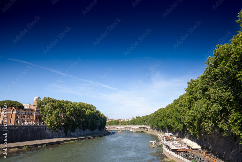 Ponte Cestio brige spans the Tiber River in Rome, italy connecting Tiber Island to the Trastevere district. Also called Cestian Bridge or pons cestius, it's a landmark of ancient rome. Ponte Cestio brige spans the Tiber River in Rome, italy connecting Tiber Island to the Trastevere district. Also called Cestian Bridge or pons cestius, it's a landmark of ancient rome.