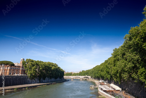 Ponte Cestio brige spans the Tiber River in Rome, italy connecting Tiber Island to the Trastevere district. Also called Cestian Bridge or pons cestius, it's a landmark of ancient rome. photo