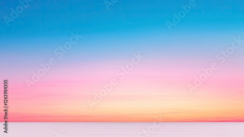 Serene sunset over calm waters, showcasing vibrant pink and blue hues in a tranquil landscape