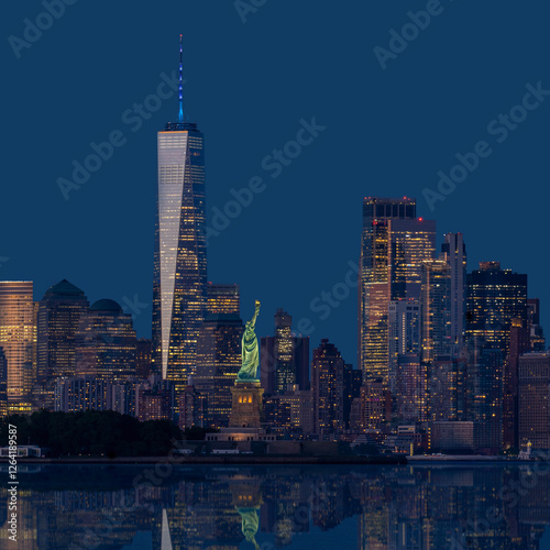 Statue of Liberty and One World Trade Center Illuminated at Night