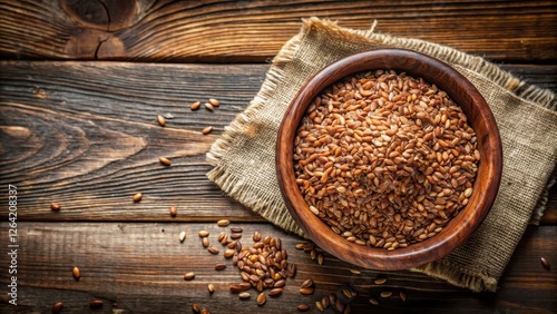 A wooden bowl filled with organic flaxseed on a rustic table from top view , botanical photography, home decor