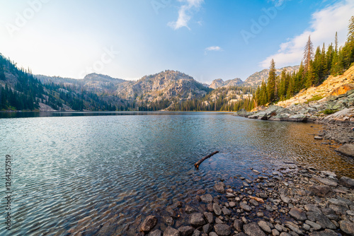 Afternoon Sun Filtering Onto Alpine Lake