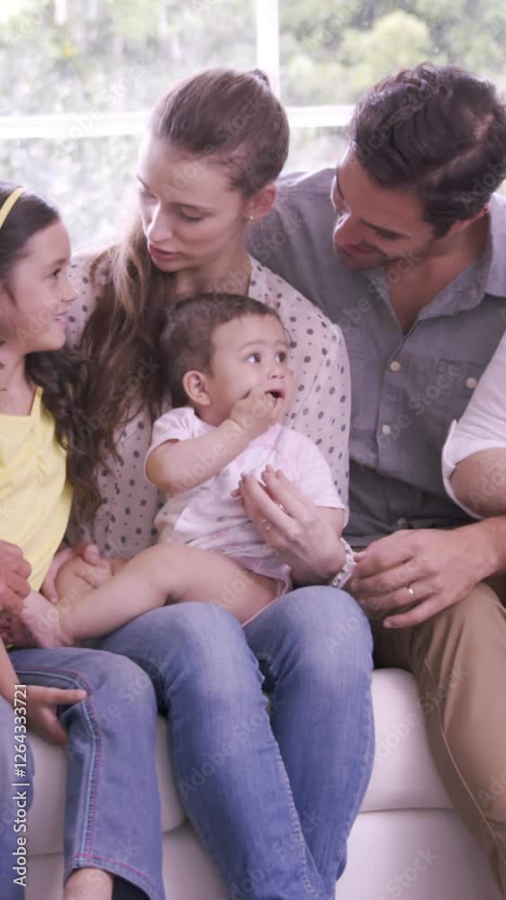 Happy extended family on sofa
