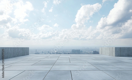 Empty square tiled floor with concrete building barriers overlooking the city skyline photo