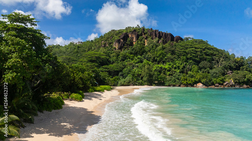 Photography Bay with soft waves lapping on a sandy beach