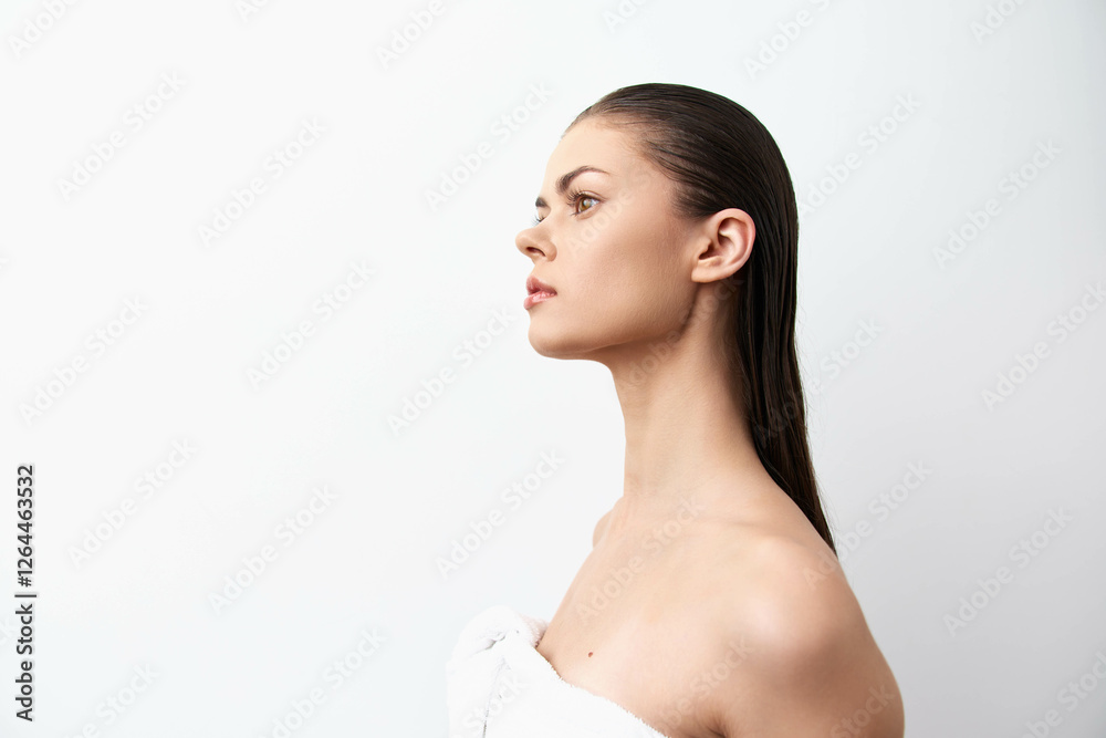 Profile view of a young woman with long straight hair against a minimalist white background, capturing elegance and beauty in a simple portrait The model exudes confidence