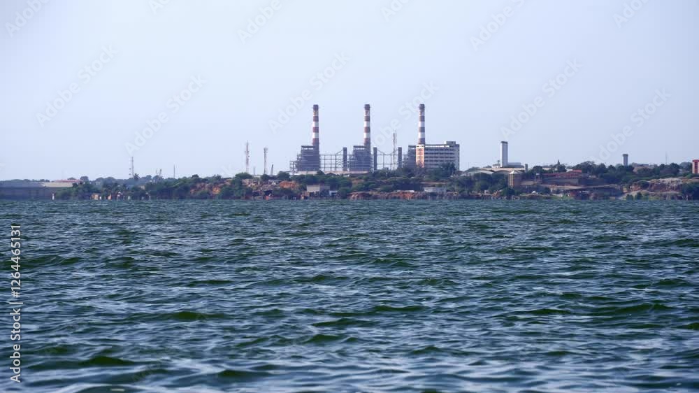 General wide view of an Oil Industry Facility on the shore of a polluted lake General wide view of an Oil Industry Facility on the shore of a polluted lake