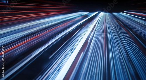 Dynamic Light Trails Speeding Through a Dark Urban Environment with a Futuristic Aesthetic
