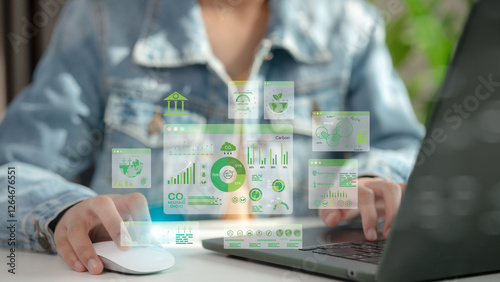 Businessmen use laptops to analyze ESG Co2 Carbon footprint Emission report graph to net zero. Green business corporate responsibility sustainable environment development goal. World Environment Day. photo