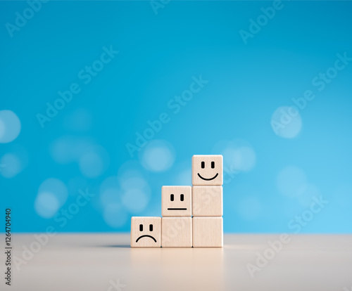 Wooden cubes stack with happy normal and sad face icons for experience survey services and product review concepts. Customer or Client shows good neutral or negative feedback and satisfaction ratings.