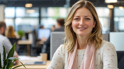 Portrait of a smiling businesswoman in a modern office environment