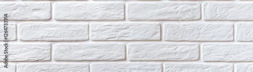 A smooth, white brick wall with a subtle texture, showcasing evenly arranged rectangular bricks in a clean, modern design. photo