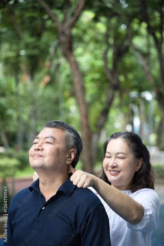 Middle aged woman therapist doing acupressure at uncle man Fengchi, Gallbladder Meridian GB20 trigger point, concept of alternative medicine, Traditional Chinese Medicine, TCM therapist Middle aged woman therapist doing acupressure at uncle man Fengchi, Gallbladder Meridian GB20 trigger point, concept of alternative medicine, Traditional Chinese Medicine, TCM therapist