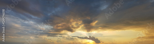 Sunrise sky background. Colourful gold sky with clouds and sun light