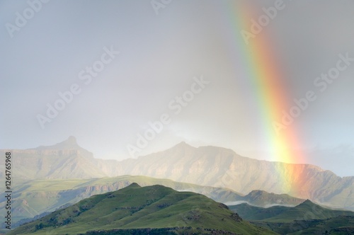EARLY MORNING RAINBOW over the giant's cup, drakensberg, south africa. 
