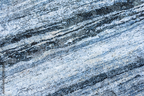 фотографія Blue Grey Stone Texture: Abstract close-up of a blue and grey stone texture, showcasing its natural striations and unique patterns