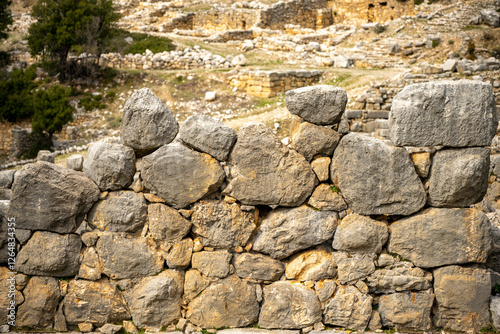 Remains of gymnasium in acnient Lycian city Arycanda. Ancient city on mountain near Aykiricay village.Well preserved semi-circular theater of Arycanda, ancient Lycian city in Antalya, Turkey.
 photo