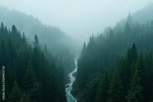 A serene mountain landscape at dawn, covered in a soft mist. The gentle morning light casts a warm glow over rolling hills, creating a peaceful and dreamy atmosphere.