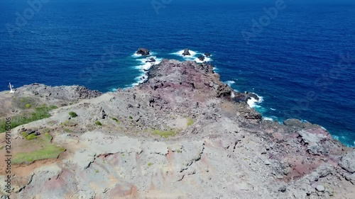 Lava rock formation Aerial view near Nakalele Blowhole, Maui – dramatic ocean water eruptions captured from above. Stunning aerial view of Hawaii’s natural water fountain photo