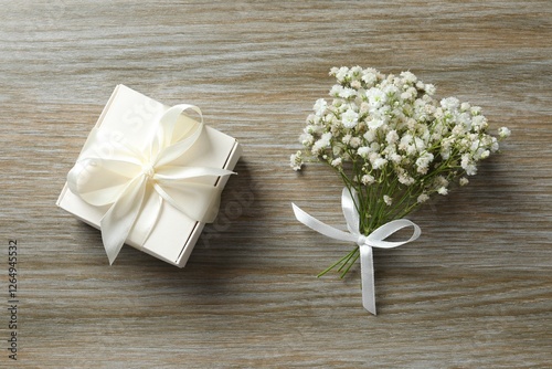 Wallpaper Mural Top view photo with gypsophila flowers and gift box on wooden background  Torontodigital.ca