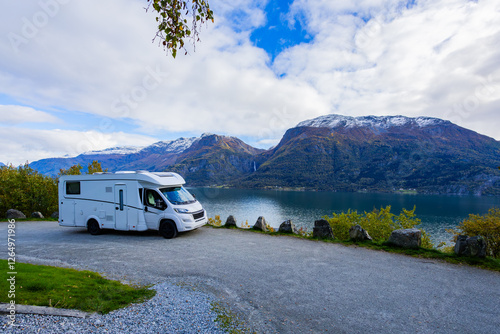 Canvastavla A motorhome parked by the serene Lustrafjorden in South Norway, with stunning mountains and a waterfall in the background