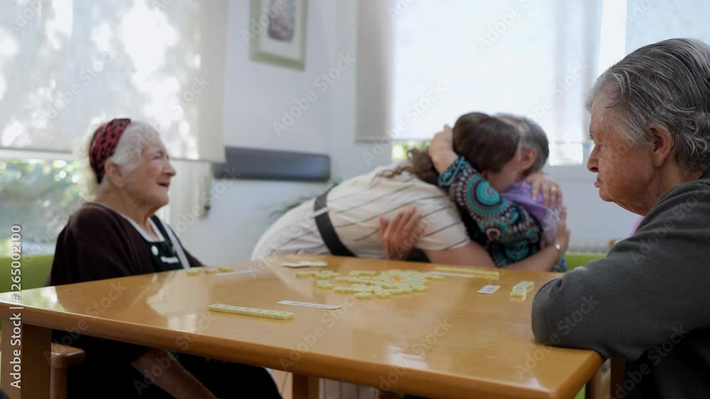 Compassionate nurse embracing senior woman, expressing deep emotional connection and care within nursing home setting, supporting elderly wellbeing through genuine tenderness