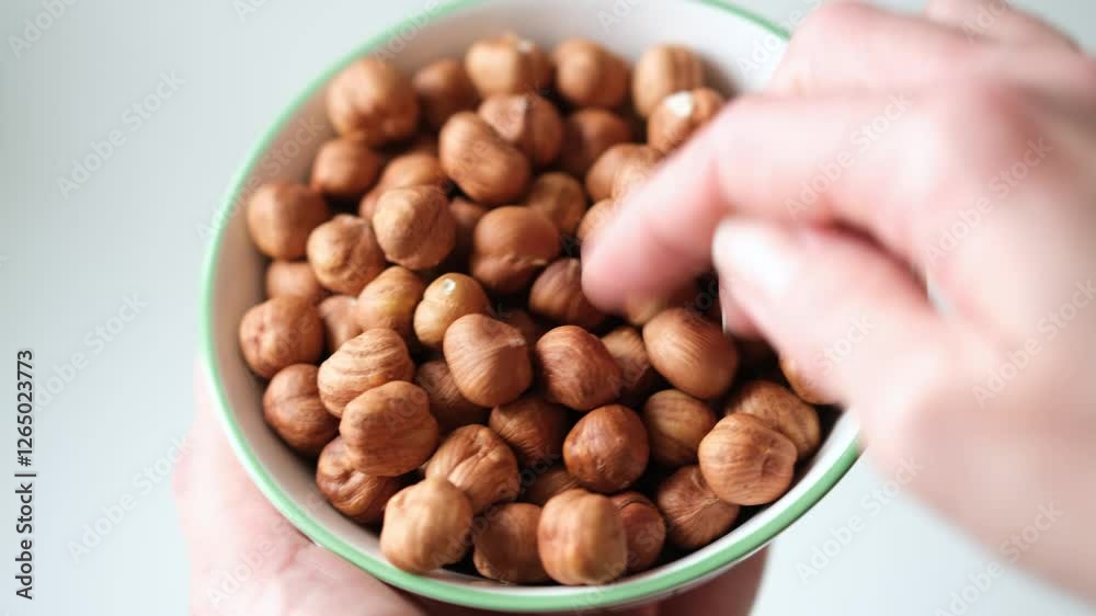 Dry roasted hazelnuts in bowl. Healthy vegan food Dry roasted hazelnuts in bowl. Healthy vegan food