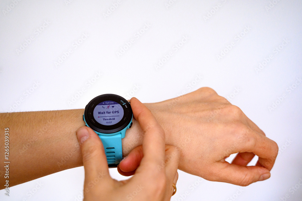 Sports watches or a smart watch for running or a tracker on a hand isolated Sports watches or a smart watch for running or a tracker on a hand isolated