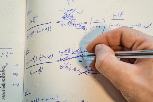Solving Mathematical Equations – Handwriting in Notebook