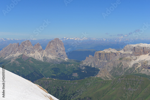 Panorama landscape of dolomite mountain Sella with summit Piz Boe. Great long distant view with blue sky from the Marmolada. Dolomites, Italy photo