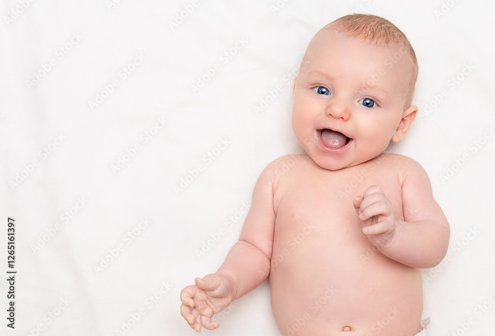 happy naked baby on light background, top view happy naked baby on light background, top view