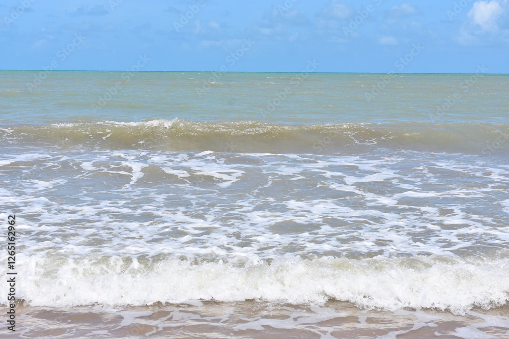Wave rolling in on a sandy tropical beach Wave rolling in on a sandy tropical beach