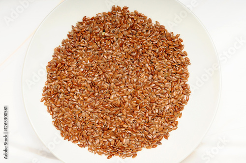 Flax Seeds in a Tray on a White Background